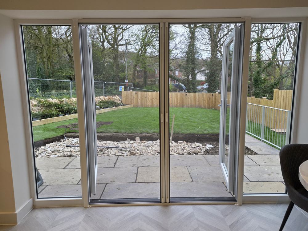 Double roller fly screen across French doors