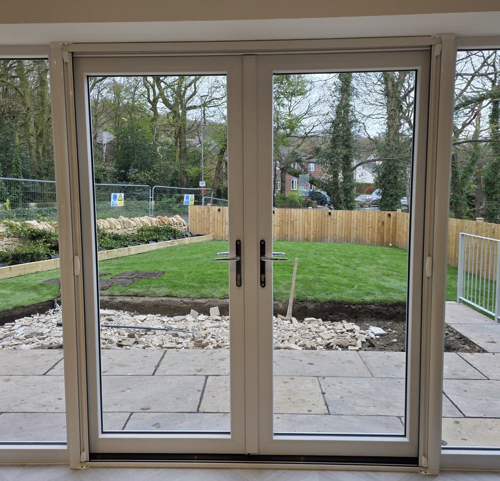 Double roller fly screen doors fitted to French doors